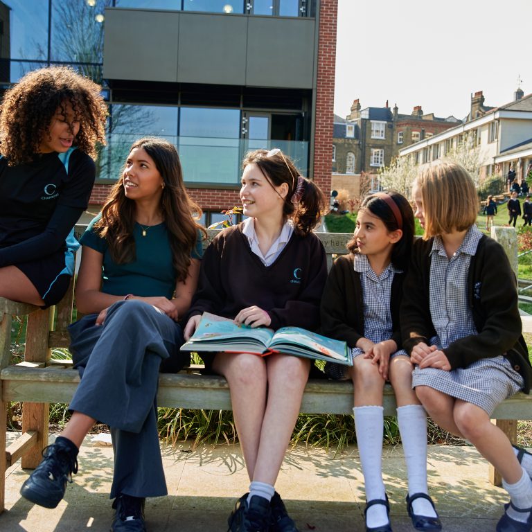 girls sat on a bench