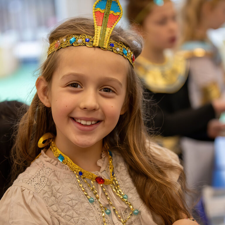 smiling child with tiara on