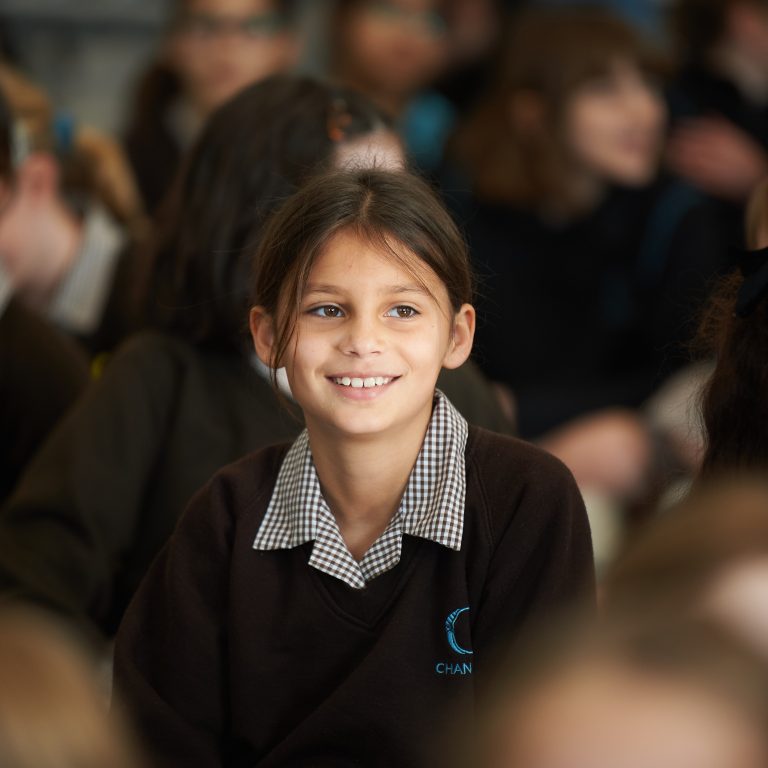 girl sat in a crowd