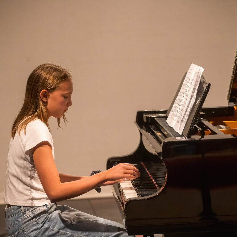 Student playing the piano