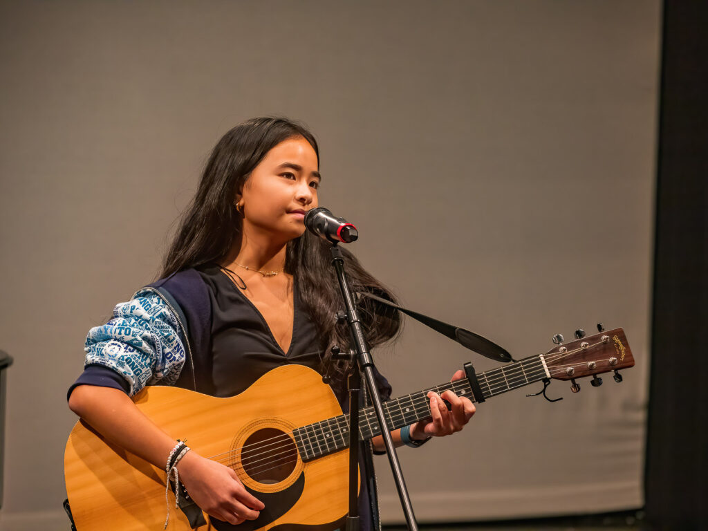 Student playing the guitar