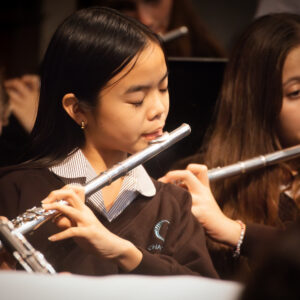 students playing flutes