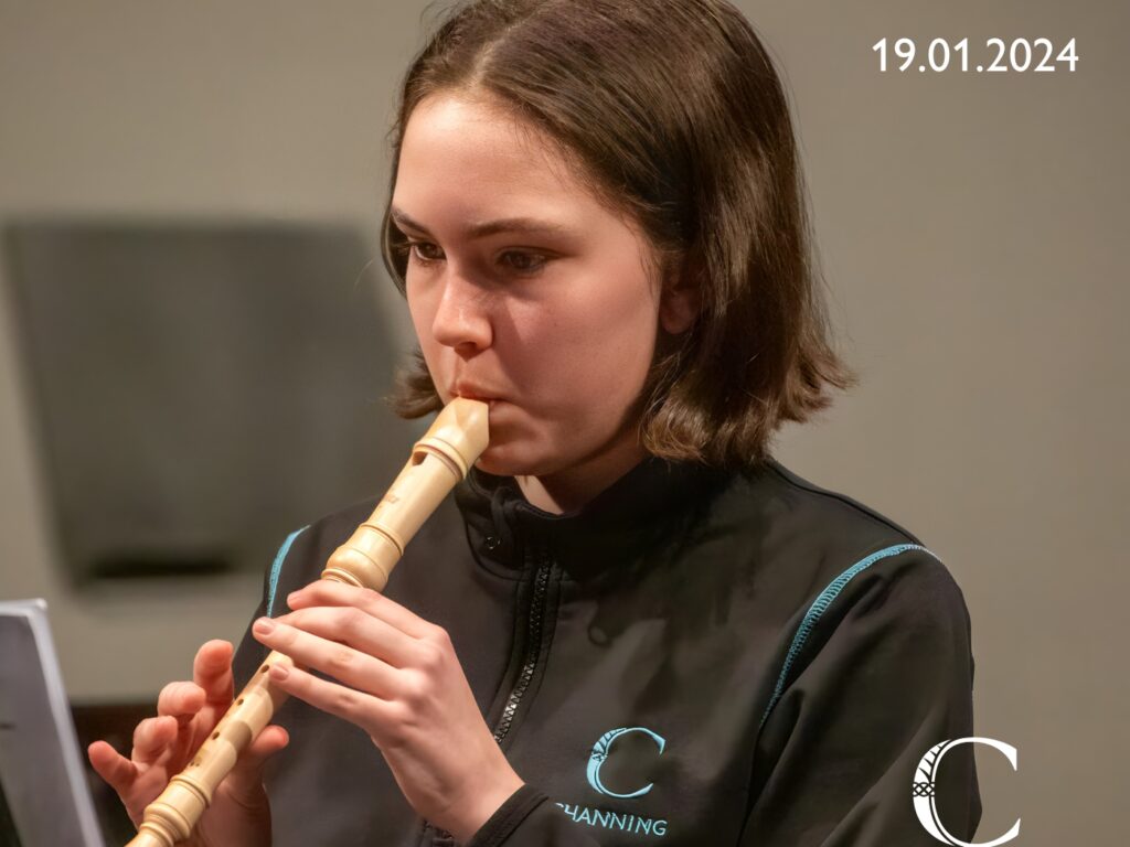 student playing the recorder