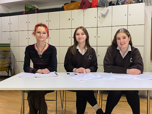 3 students sat at a table