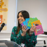 teacher with cards in her hand