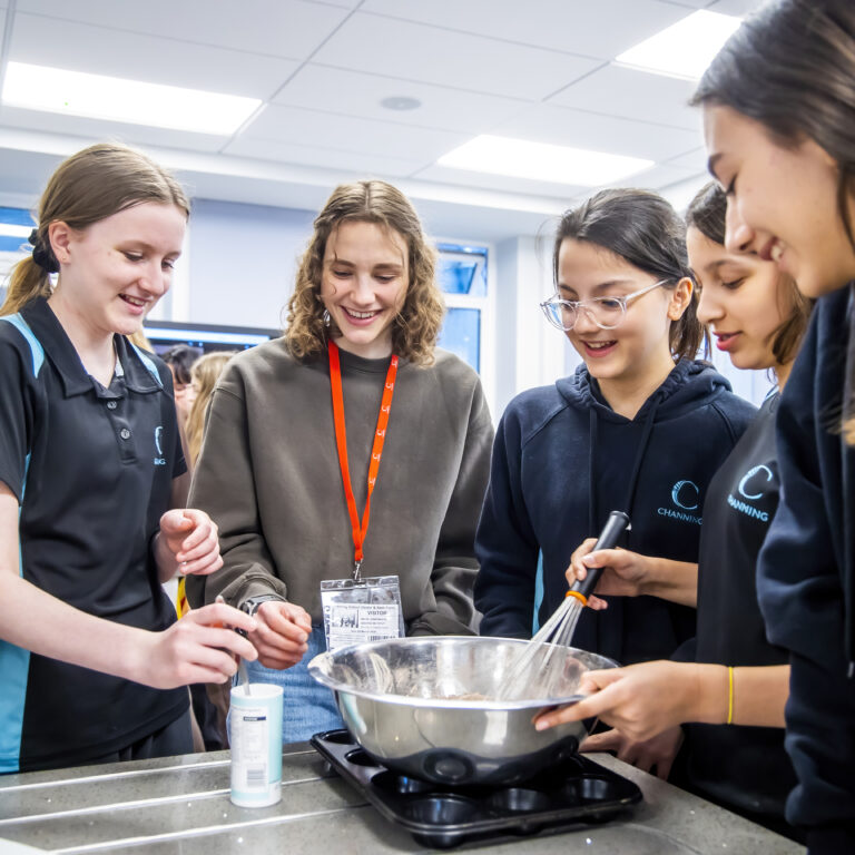 girls putting mix into trays