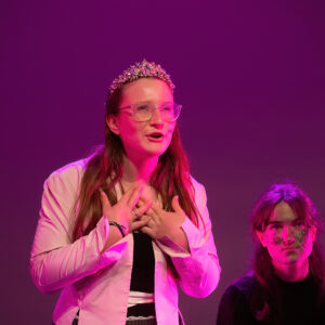 student on stage for wicked