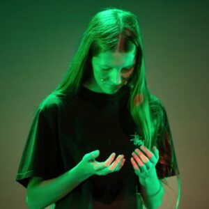 student on stage for wicked