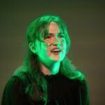 student on stage for wicked