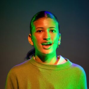 student on stage for wicked