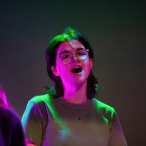 student on stage for wicked