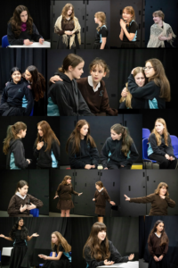 Group of young girls in dark costumes rehearsing on a stage, showing various poses and expressions.
