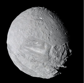Close-up view of a gray, cratered asteroid with a rough surface, isolated against a black space background.